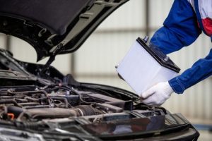 Hand,of,male,mechanic,changing,car,battery,,car,battery,repairman - meineke car care centers virginia Meineke Car Care | Car Battery | Williamsburg